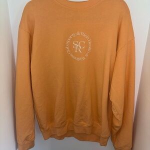 Sporty & Rich Orange Sweatshirt with Circular Emblem